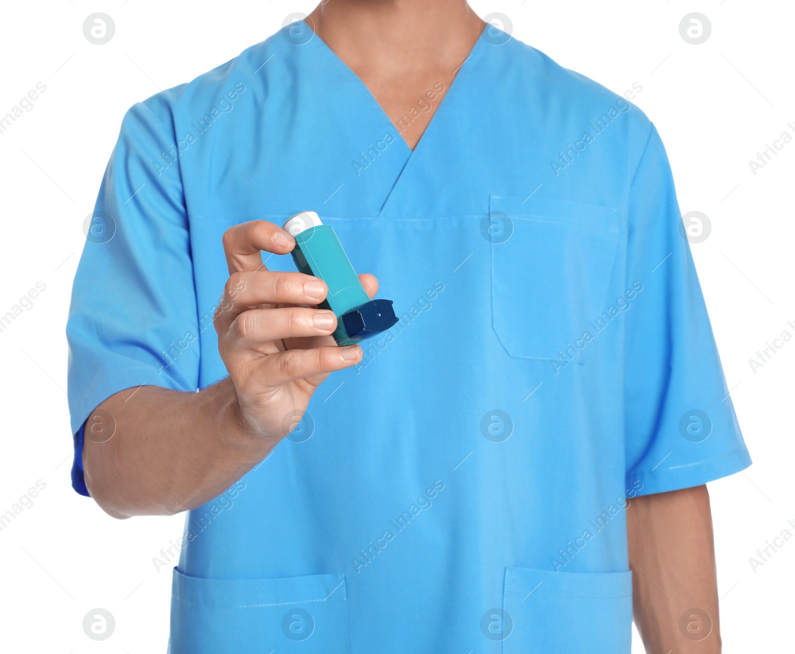 Photo of Male doctor holding asthma inhaler on white background, closeup. Medical object