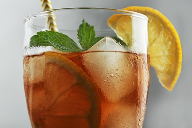 Photo of Glass of delicious iced tea, closeup view