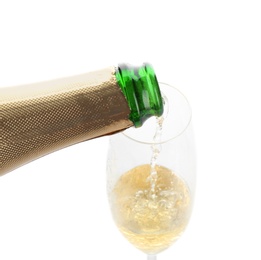 Pouring champagne from bottle into glass on white background. Festive drink