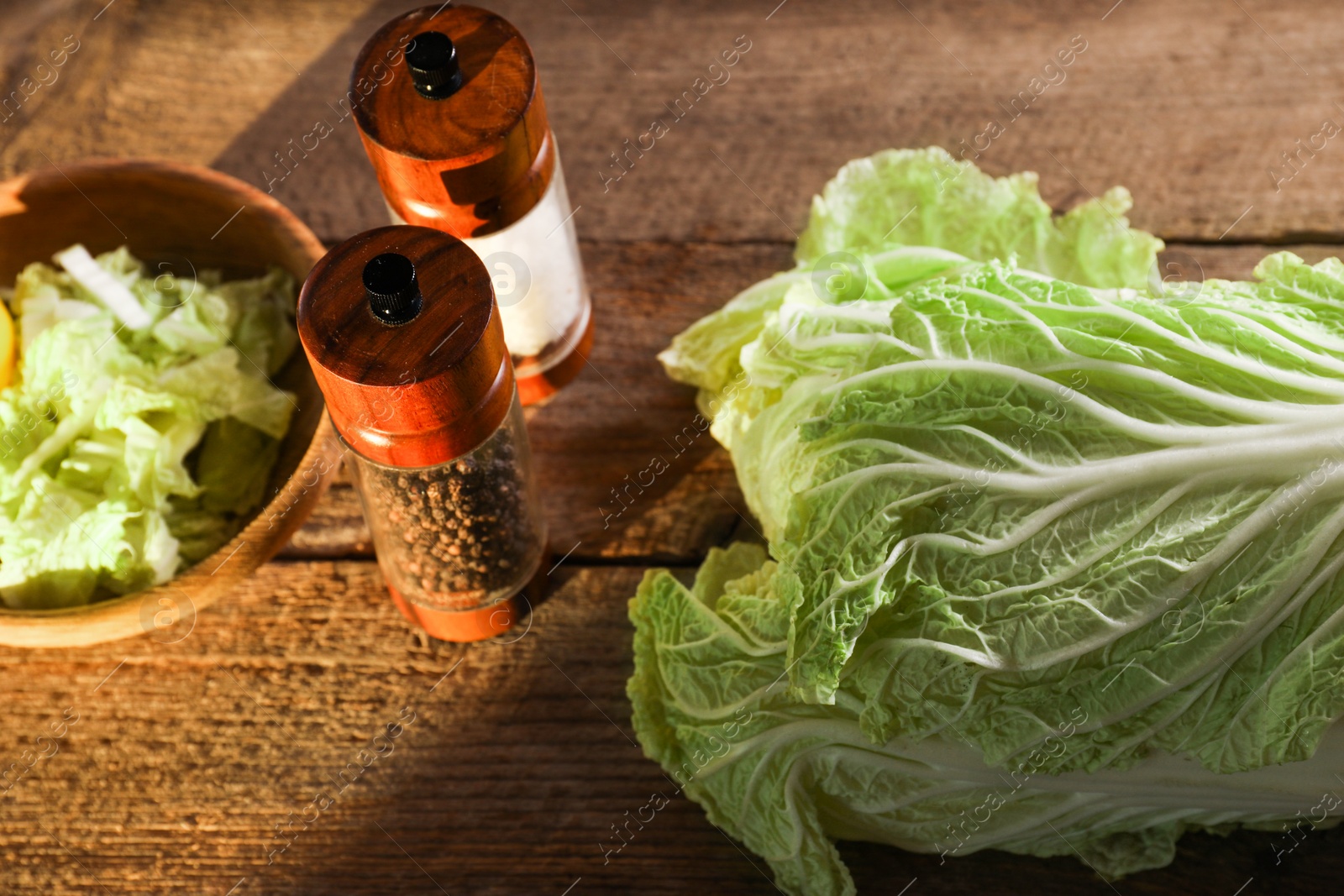 Photo of Fresh Chinese cabbage and spices on wooden table, above view