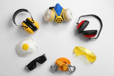 Photo of Flat lay composition with safety equipment and space for text on white background