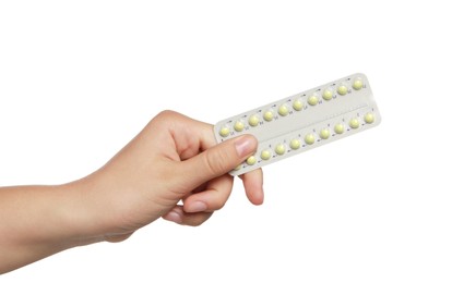 Photo of Woman holding blister of oral contraception pills on white background, closeup