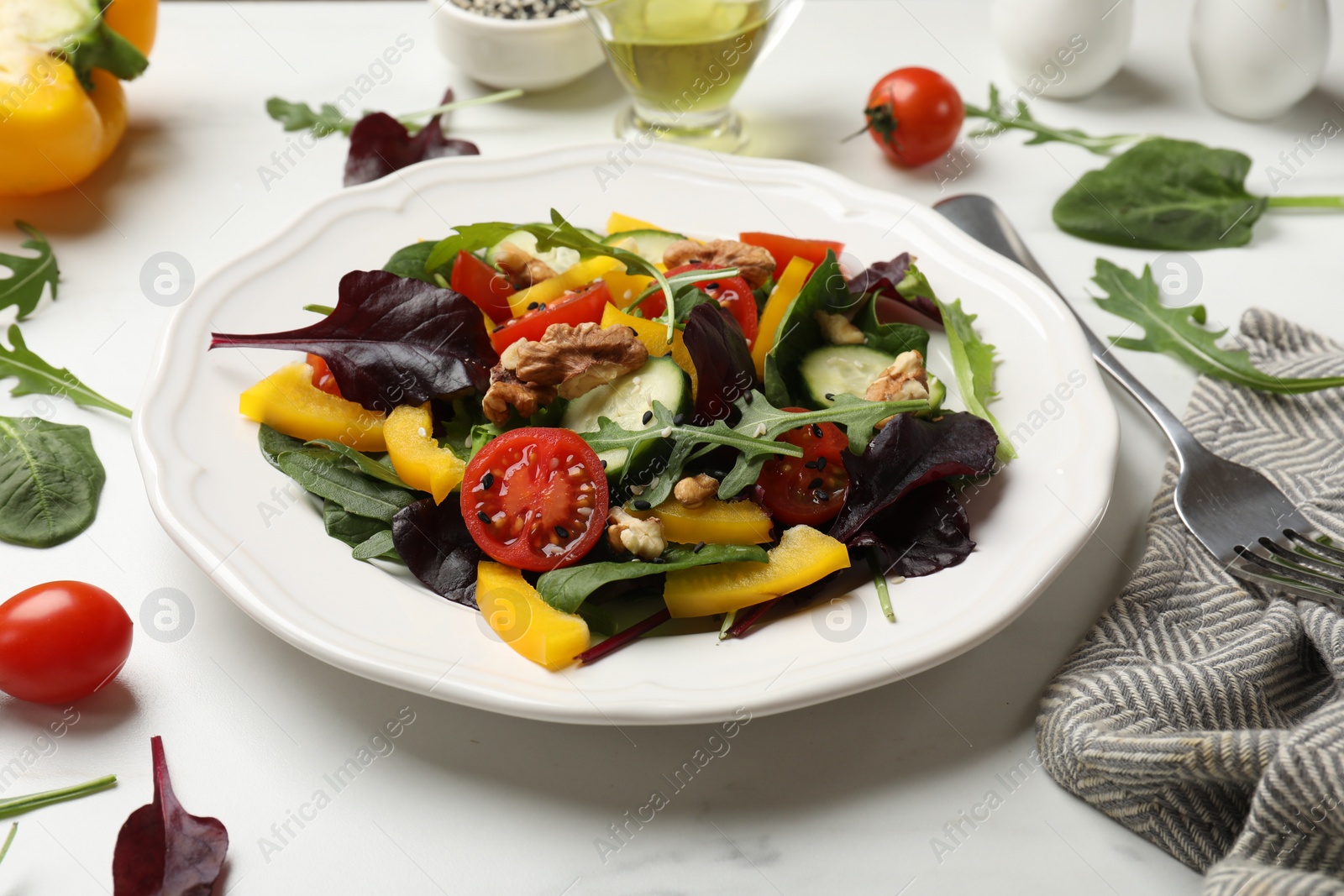 Photo of Tasty fresh vegetarian salad on white marble table