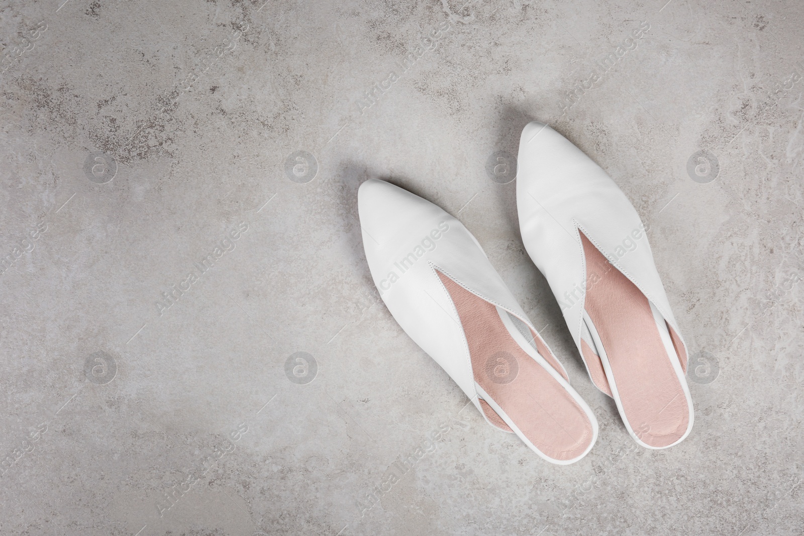 Photo of Pair of shoes on gray background, top view