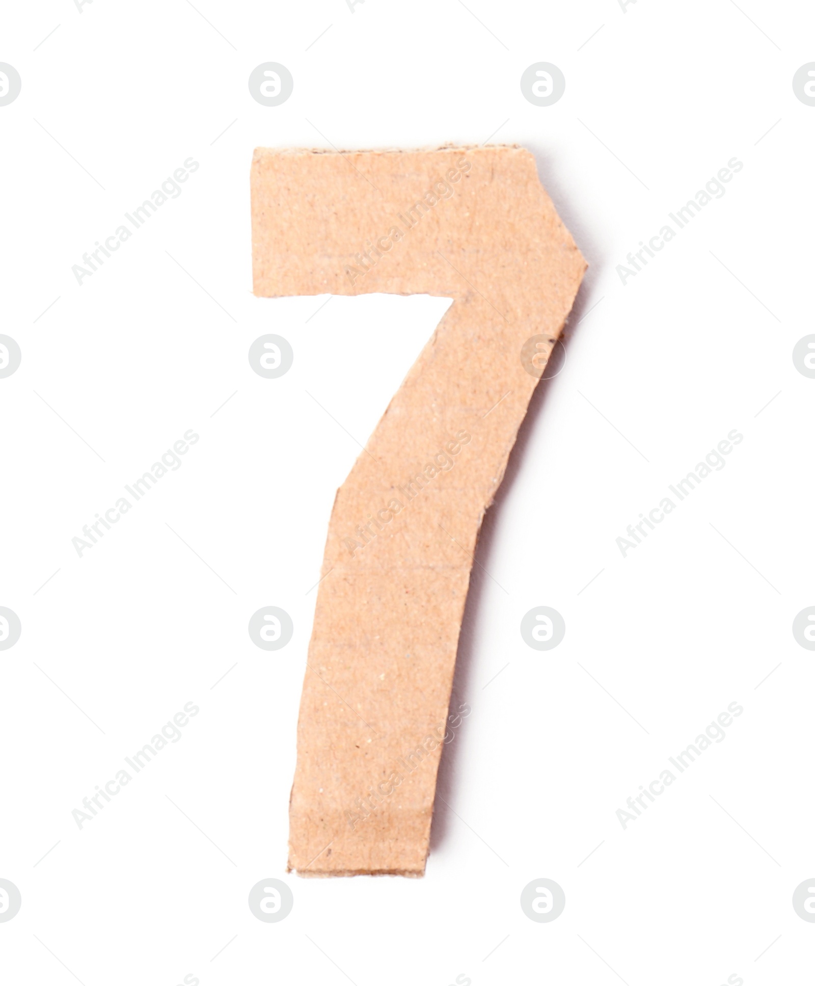 Photo of Number 7 made of brown cardboard on white background