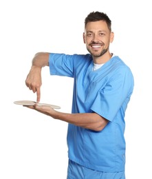 Photo of Handsome male orthopedist showing insole on white background