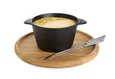 Photo of Fondue with tasty melted cheese and forks isolated on white