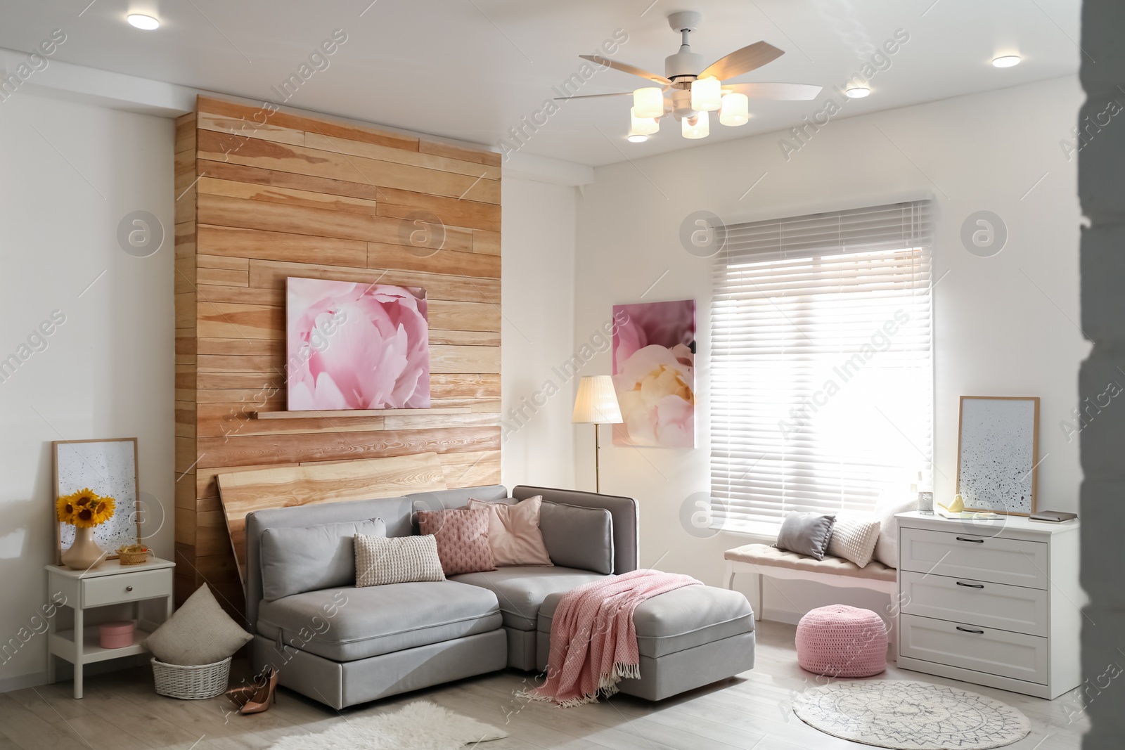 Photo of Stylish living room interior with modern ceiling fan and comfortable couch