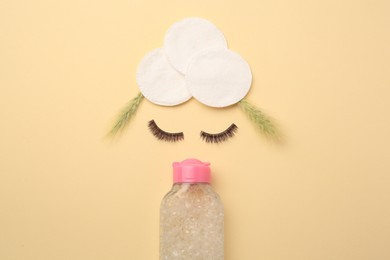 Photo of Flat lay composition with makeup remover, spikelets and false eyelashes on yellow background