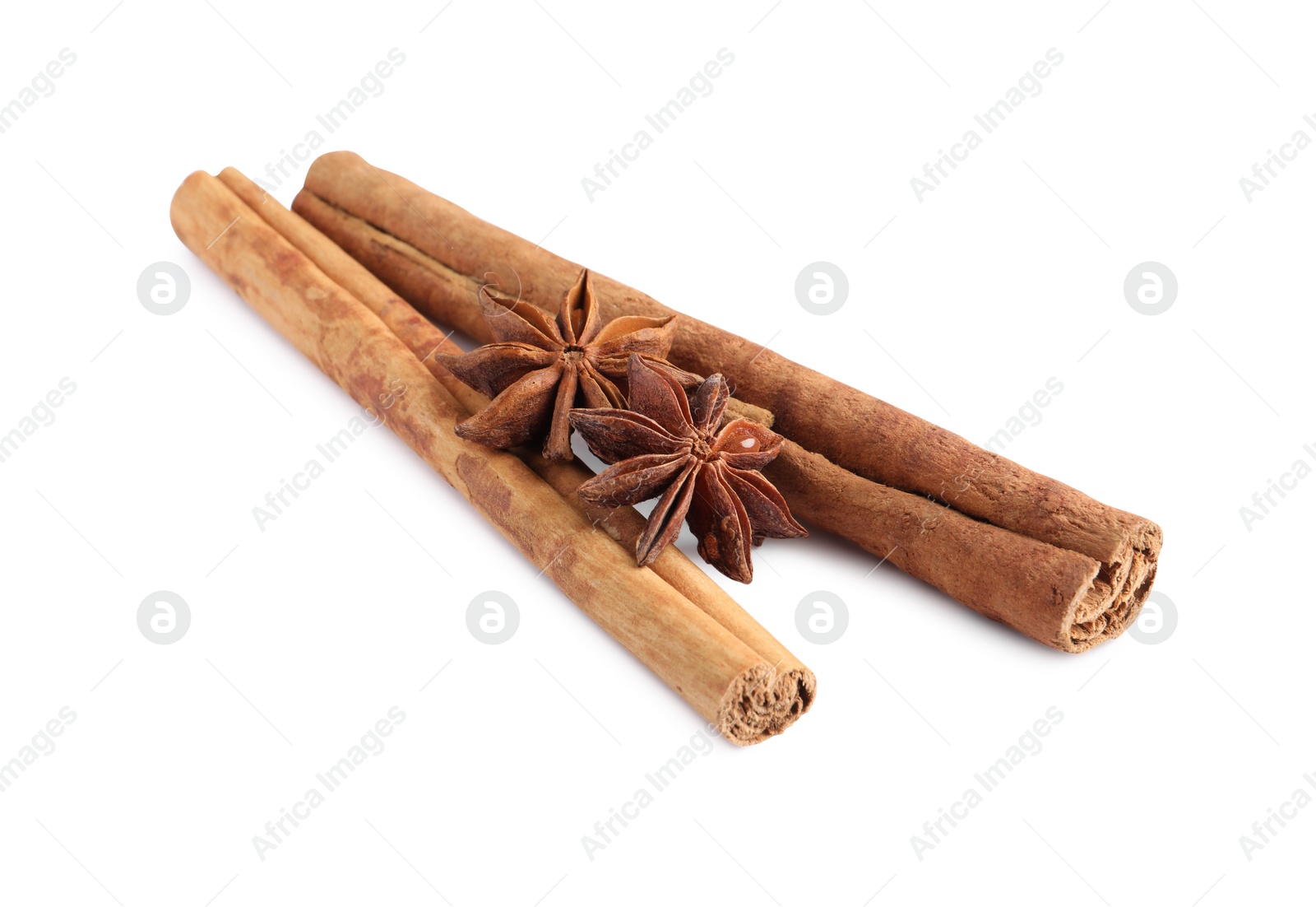 Photo of Cinnamon sticks and anise stars isolated on white