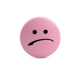 Image of Pink pill with sad face on white background