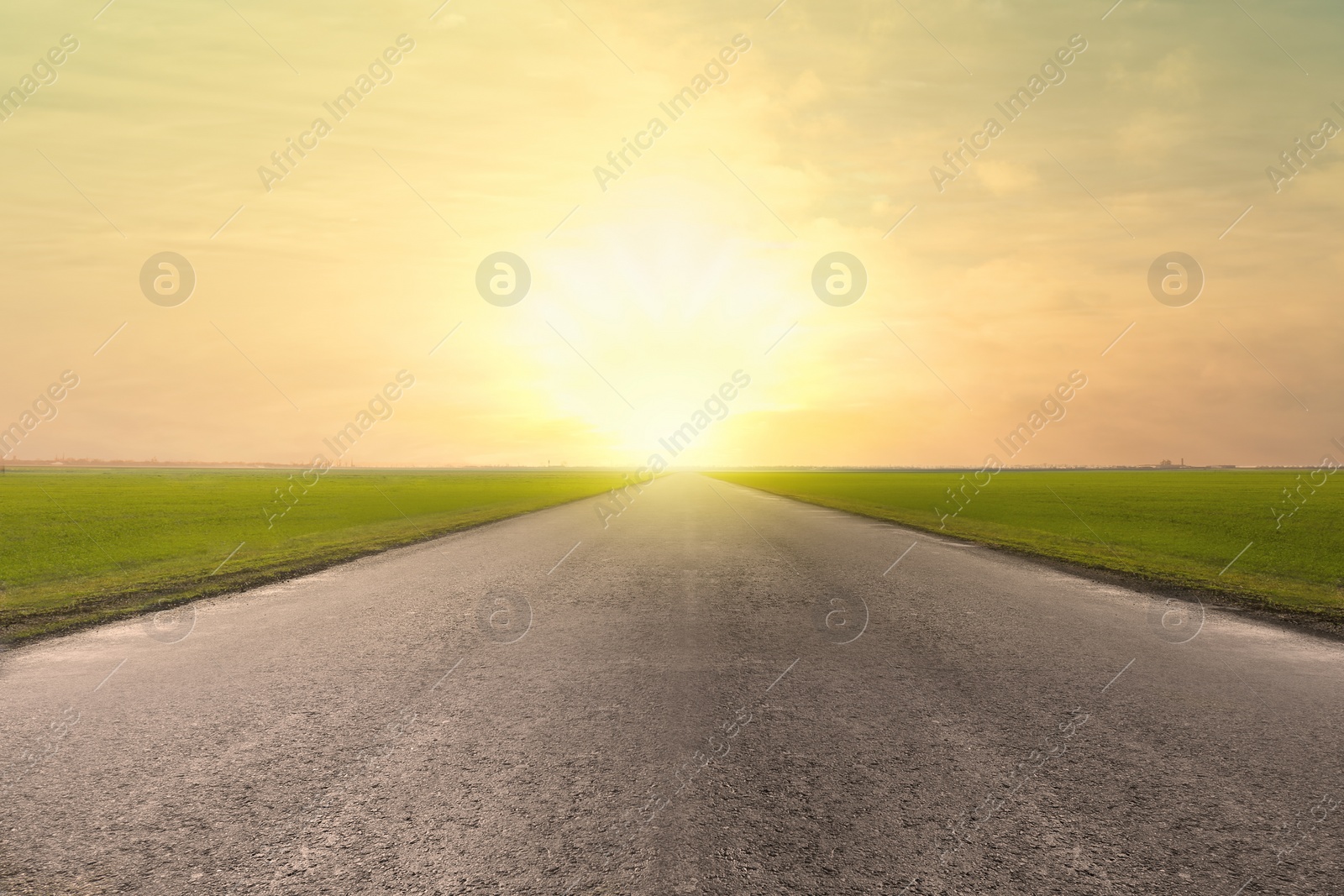 Image of Road trip. Beautiful view of asphalt highway at sunset 