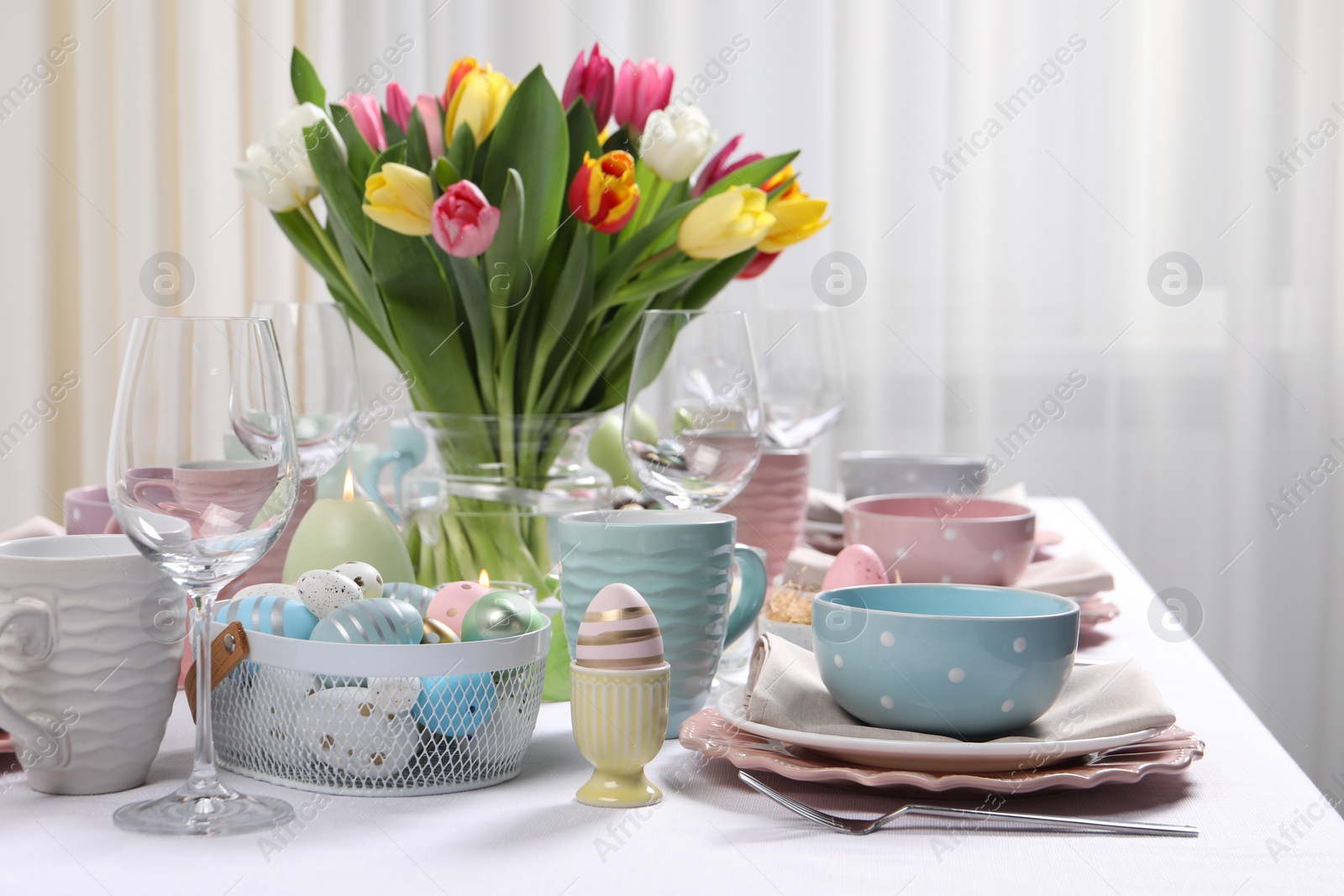 Photo of Festive table setting with beautiful flowers. Easter celebration