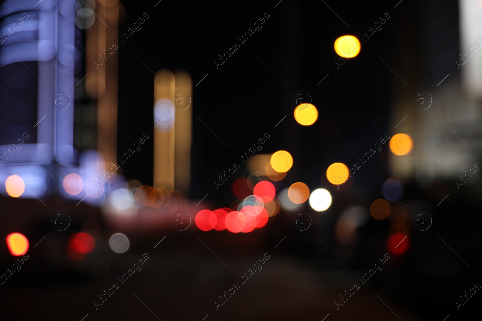 Photo of Blurred view of cityscape with bokeh effect. Night life