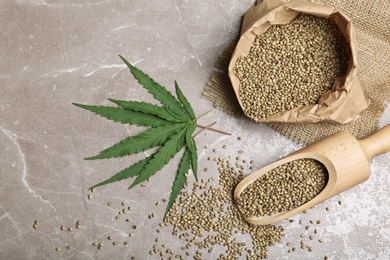 Photo of Flat lay composition with hemp seeds on grey background