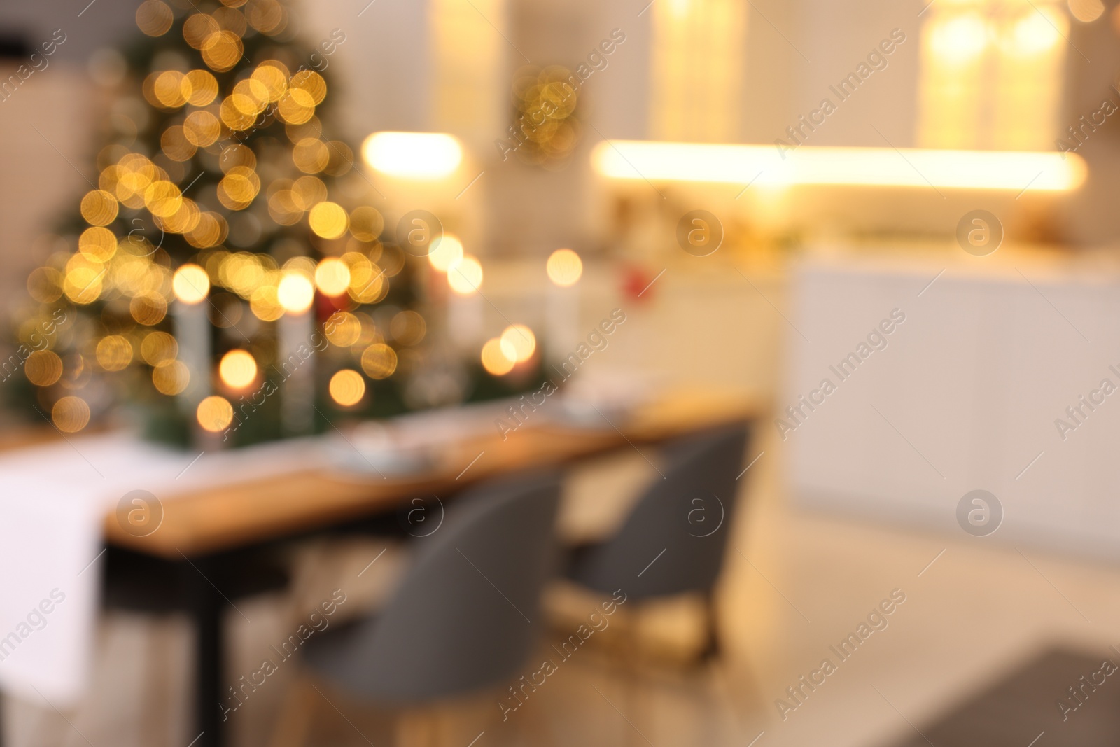 Photo of Blurred view of cozy kitchen decorated for Christmas. Interior design