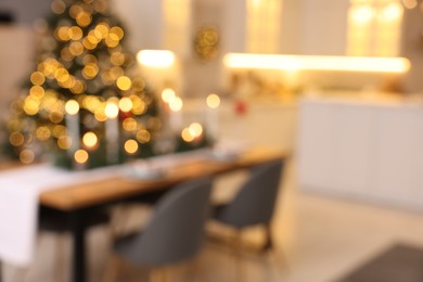 Photo of Blurred view of cozy kitchen decorated for Christmas. Interior design