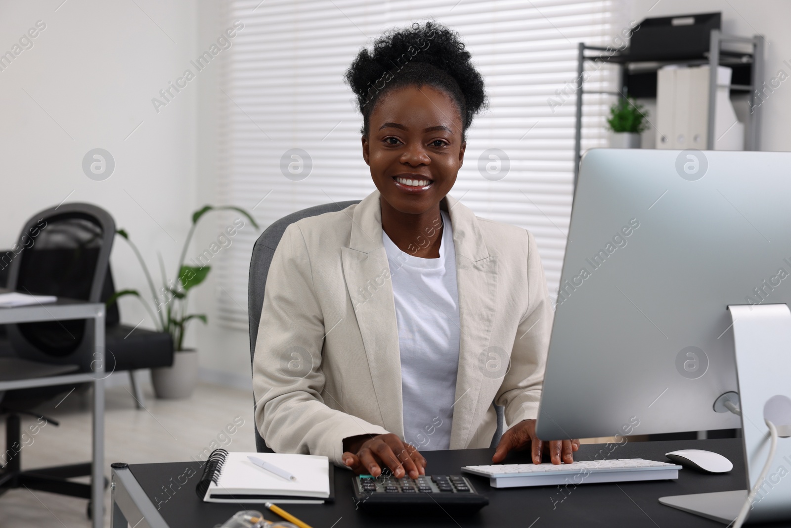 Photo of Professional accountant working at desk in office