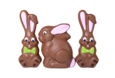 Photo of Many chocolate bunnies isolated on white. Easter celebration