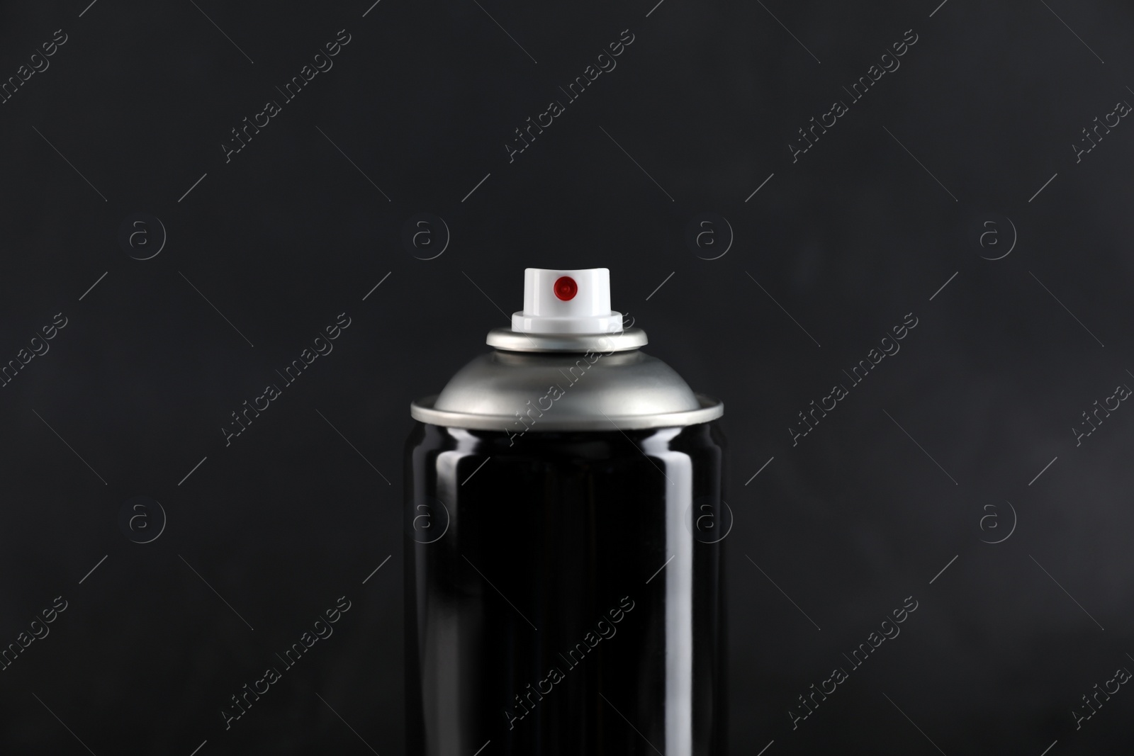 Photo of Can of spray paint on black background, closeup