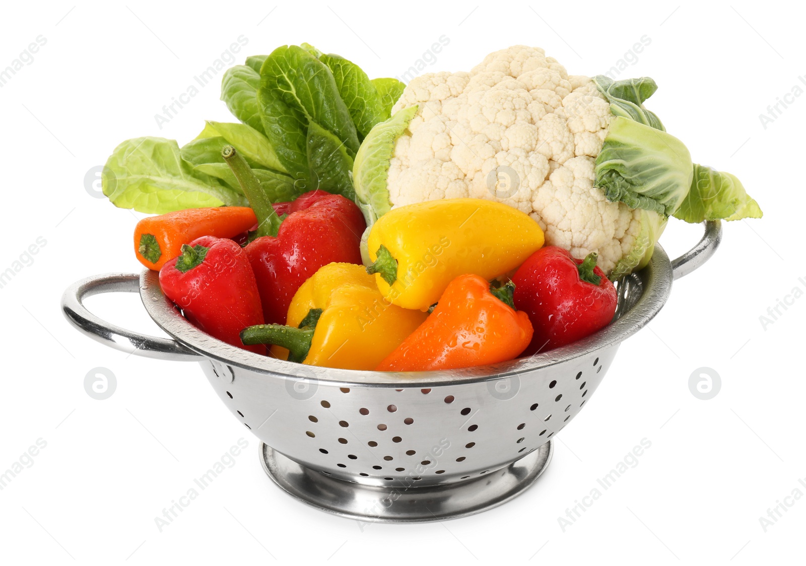 Photo of Metal colander with different vegetables isolated on white