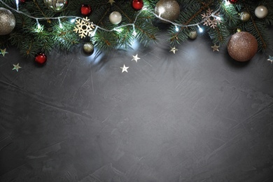 Photo of Christmas decoration on stone background, flat lay. Space for text