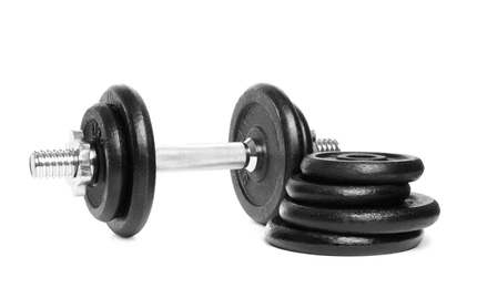 Photo of Professional dumbbell and weight plates on white background. Sporting equipment