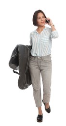 Photo of Woman holding garment cover with clothes while talking on phone, isolated on white. Dry-cleaning service