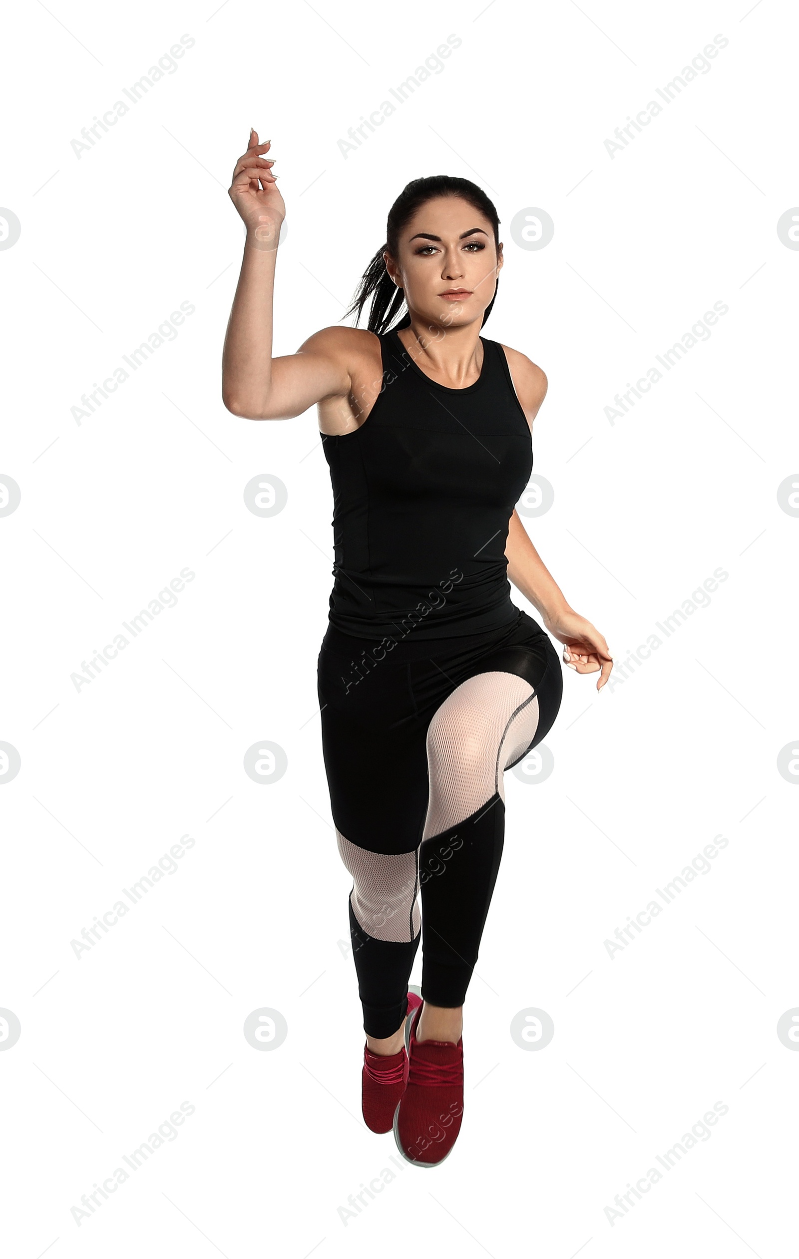 Photo of Sporty young woman running on white background