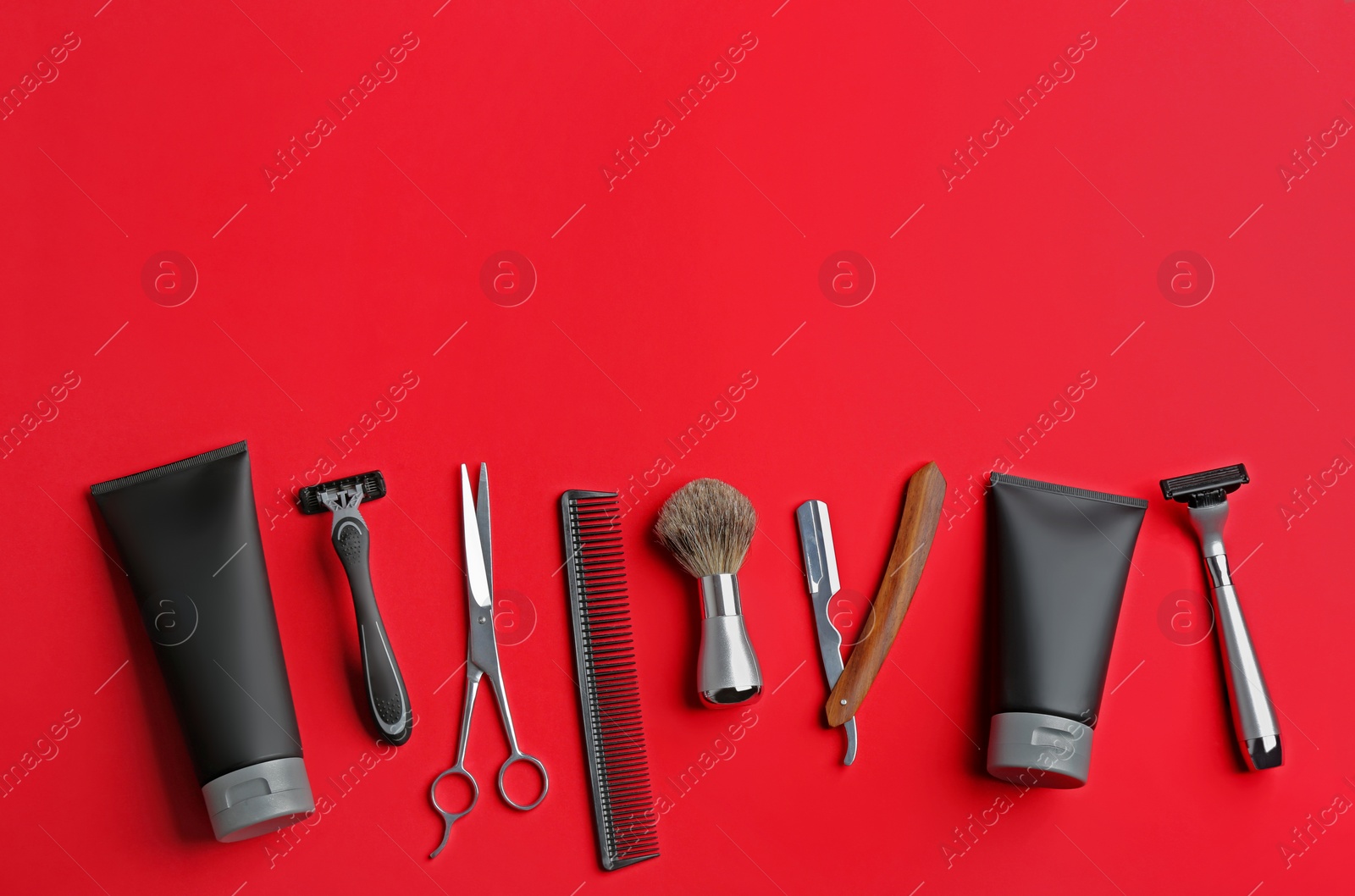 Photo of Set of barber's equipment and men's cosmetic products on color background, flat lay. Space for text