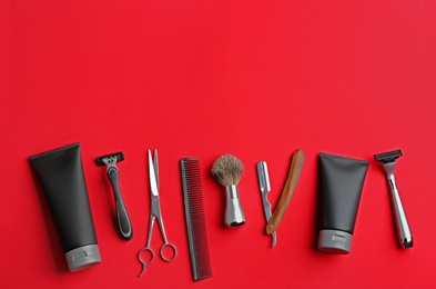 Photo of Set of barber's equipment and men's cosmetic products on color background, flat lay. Space for text