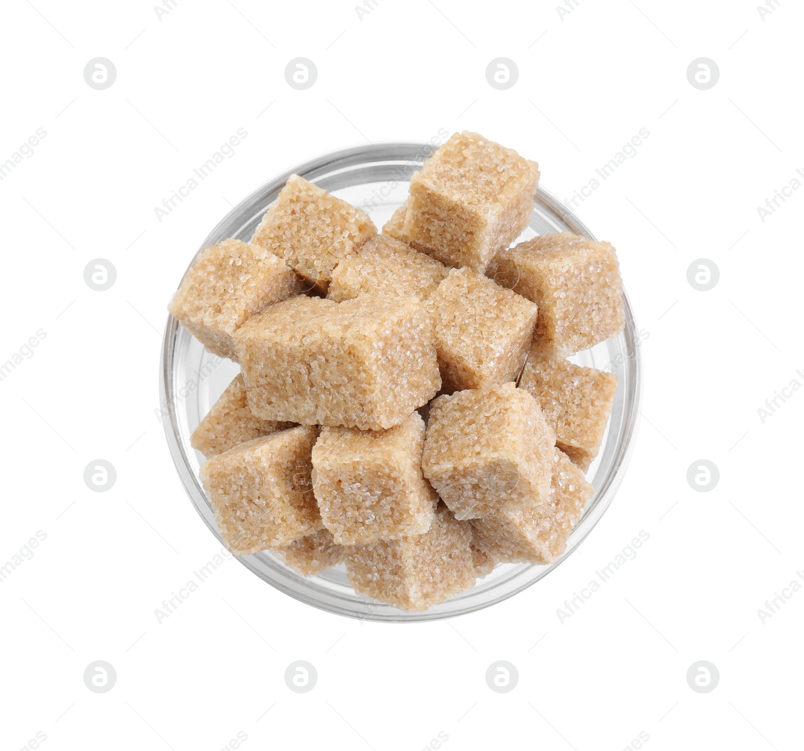 Photo of Brown sugar cubes in glass bowl isolated on white, top view