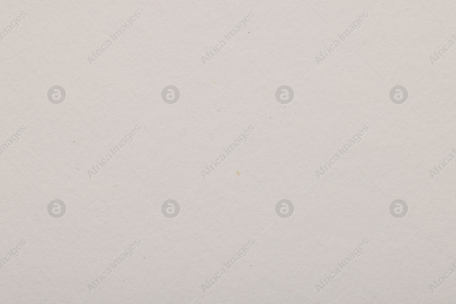 Photo of Texture of light grey paper sheet as background, top view