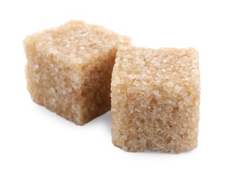 Photo of Two brown sugar cubes isolated on white