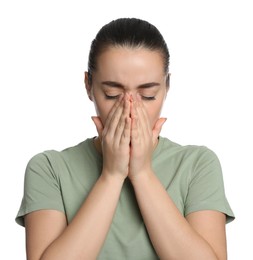 Young woman suffering from headache on white background