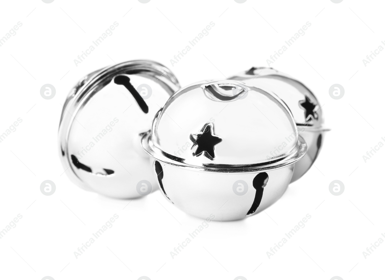 Photo of Shiny silver sleigh bells on white background