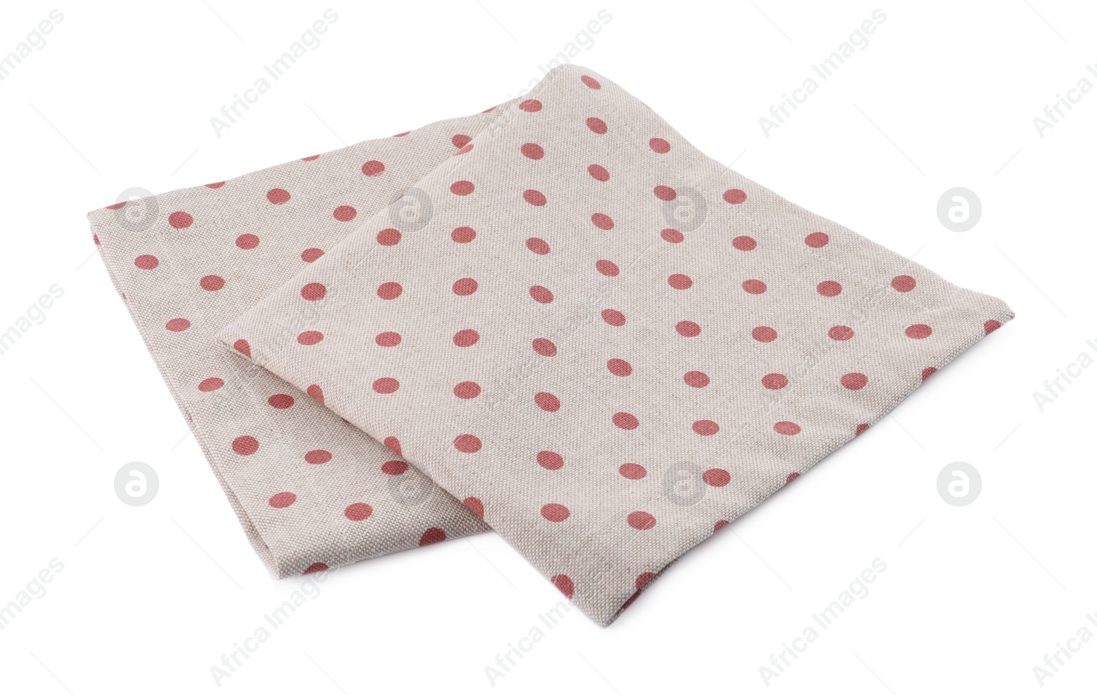 Photo of Cloth kitchen napkin with polka dot pattern isolated on white