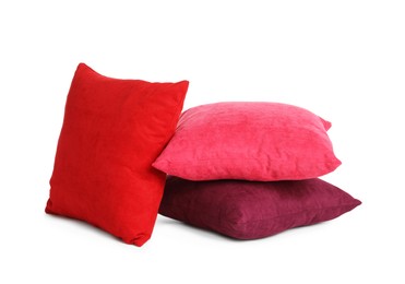 Different colorful decorative pillows on white background