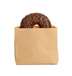 Photo of Paper bag with donut on white background. Space for design