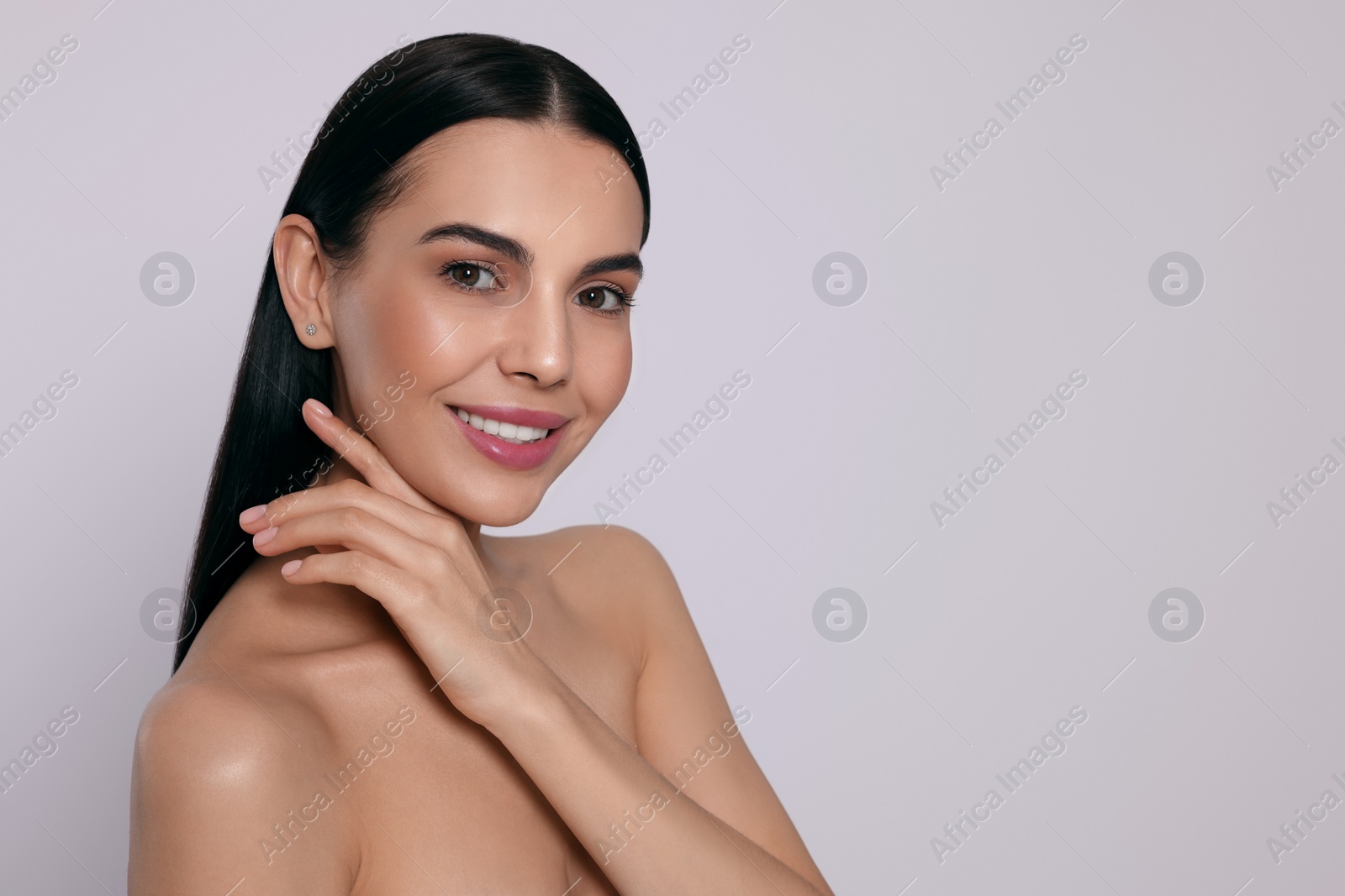 Photo of Portrait of attractive young woman on light grey background, space for text. Spa treatment