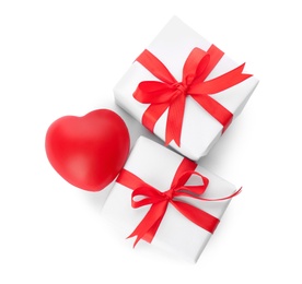 Photo of Beautiful gift boxes and red heart on white background, top view. Valentine's day celebration