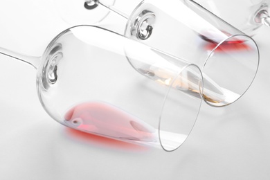 Photo of Glasses with different wine on white background, closeup