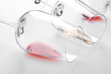 Glasses with different wine on white background, closeup