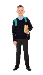 Photo of Full length portrait of cute boy in school uniform with book and backpack on white background