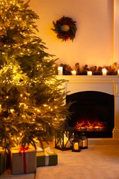 Photo of Beautiful living room interior with decorated Christmas tree