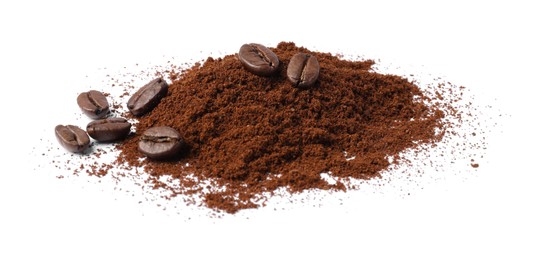 Photo of Heap of ground coffee and beans on white background