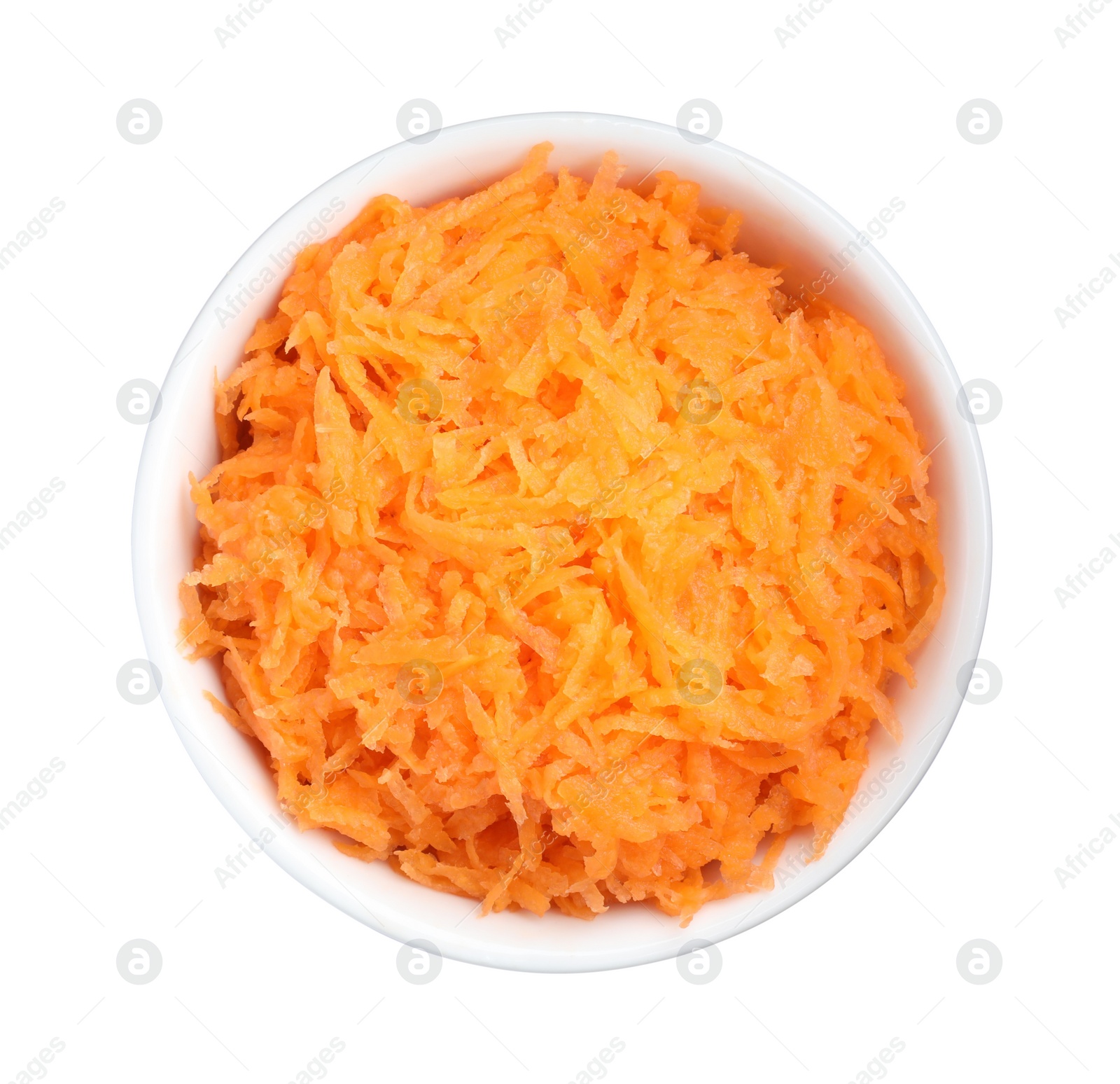 Photo of Fresh grated carrot in bowl isolated on white, top view