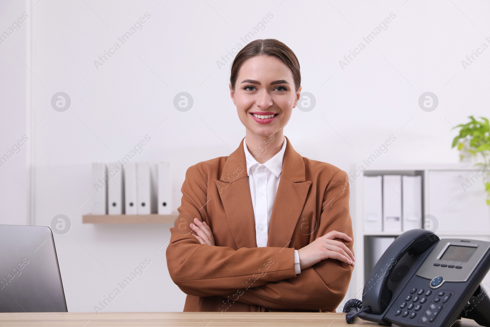 Photo of Portrait of female receptionist at desk in hotel