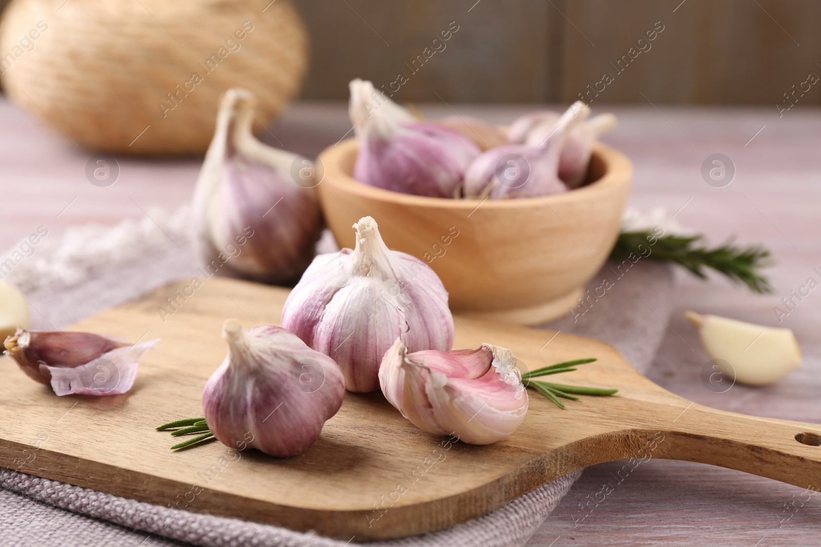 Photo of Bulbs and cloves of fresh garlic on table, closeup