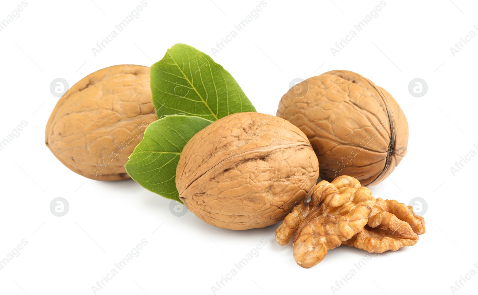 Photo of Fresh ripe walnuts with leaves on white background